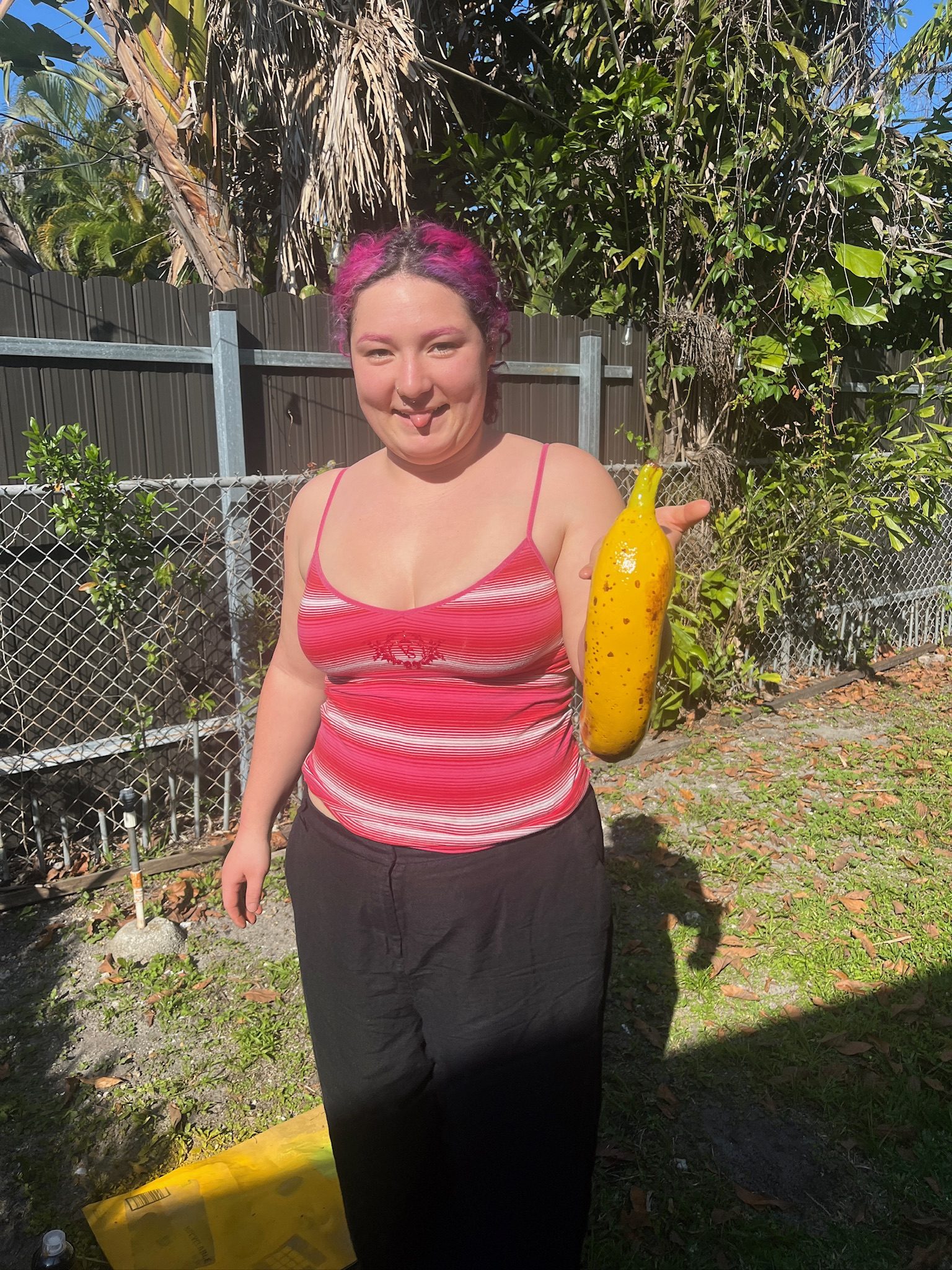 Holding the finished painted banana handset